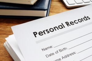 Personal records containing sensitive information sitting on a desk